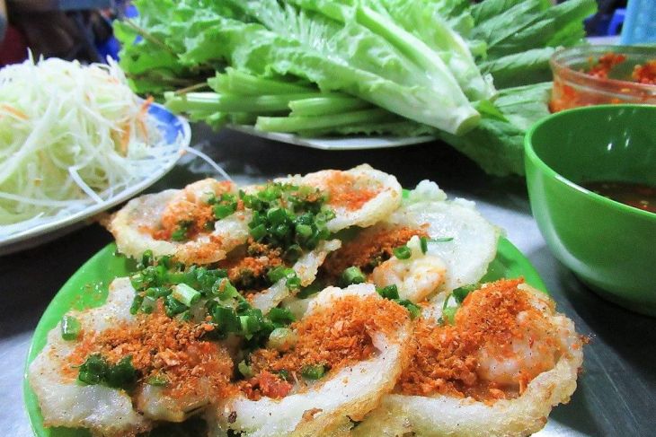 Eating Banh Khot In Vietnam